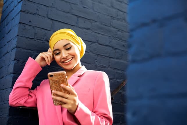 a young attractive muslim woman taking a selfie