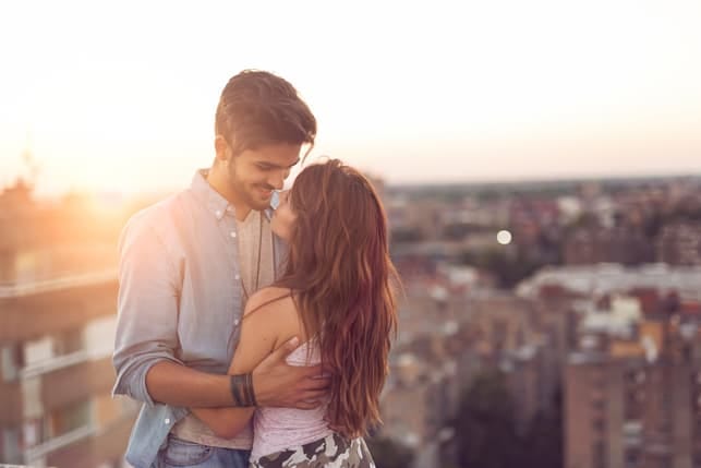 a young couple looking in each others eyes