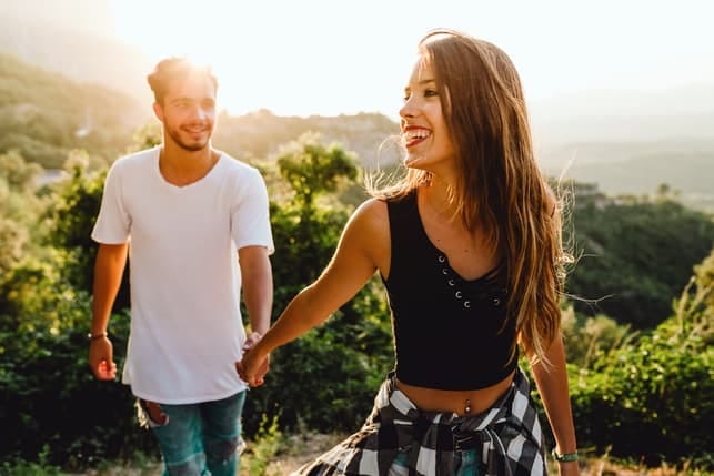a couple going for a walk in the forest