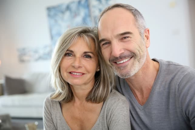 a portrait of a senior couple posing together