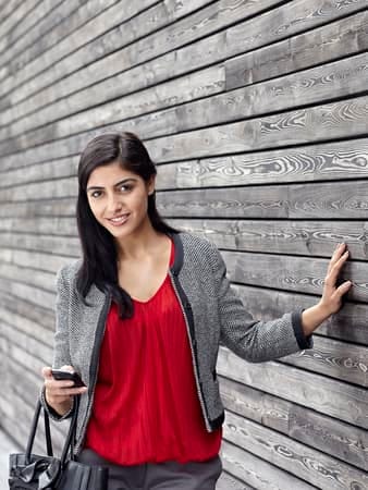 a portrait of a young woman in a red dress