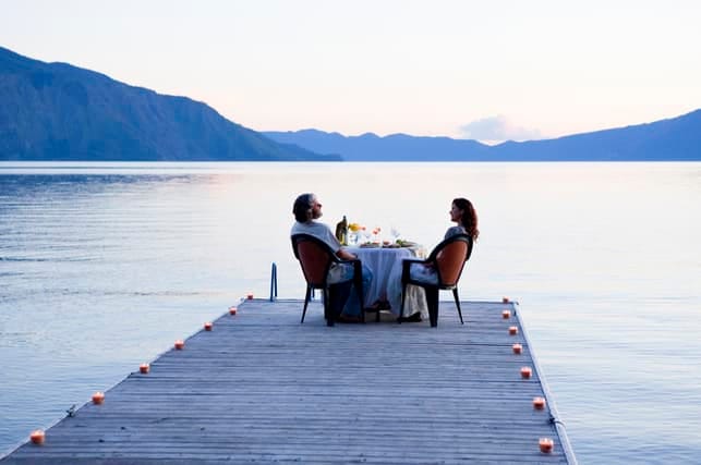 a couple on a date near river