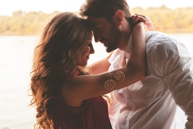 a beautiful Turkish couple cuddling and posing romantically