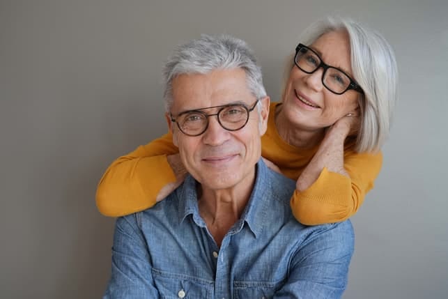 a senior couple posing together