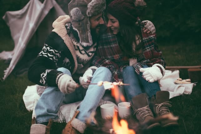 a couple having fun while camping