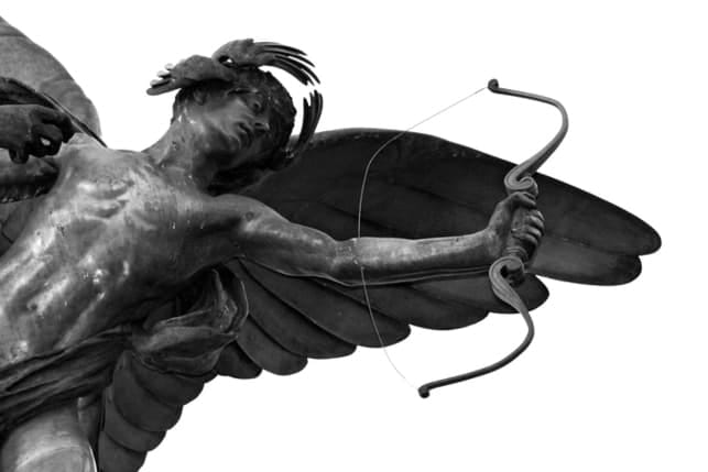 breathtaking black statue of a cupid