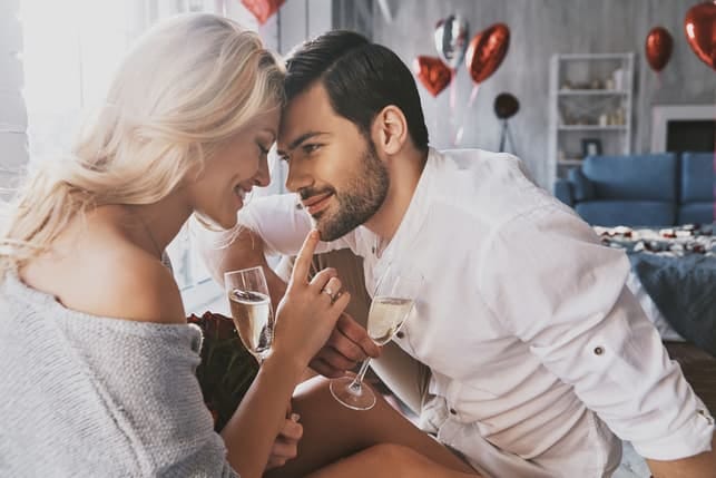 a couple hugging and spending time together at home